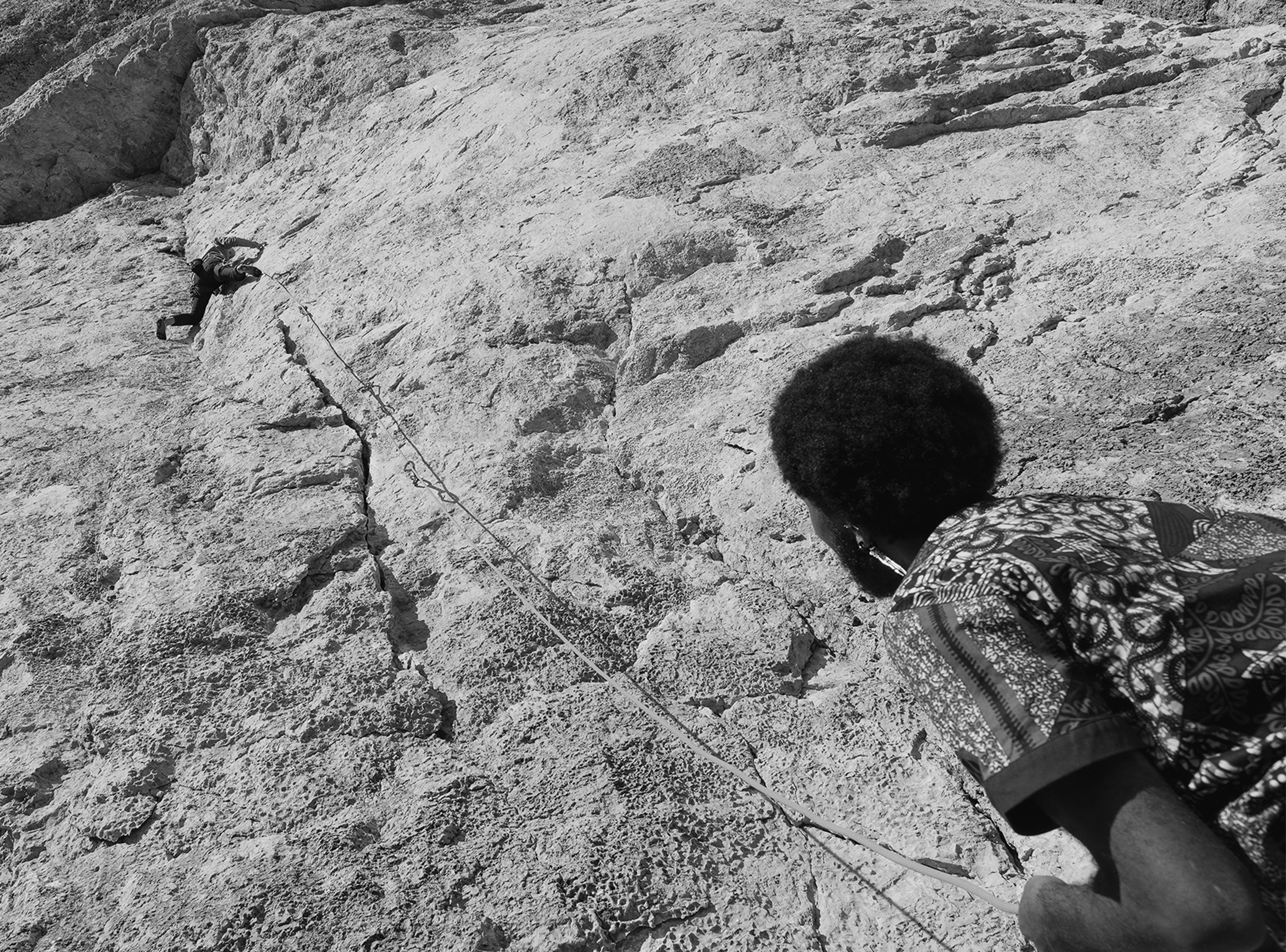 Arcteryx - Belaying a rock climber